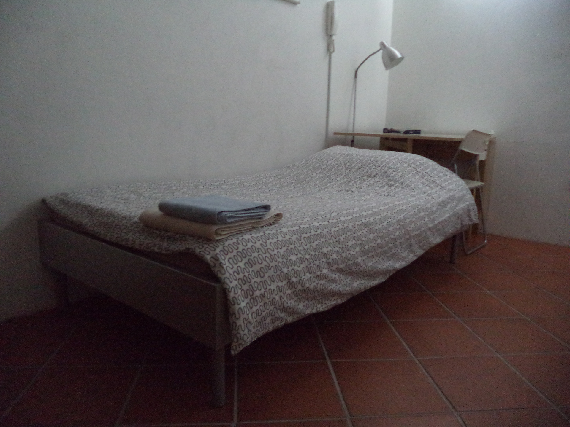 A single bed in one of the bedrooms