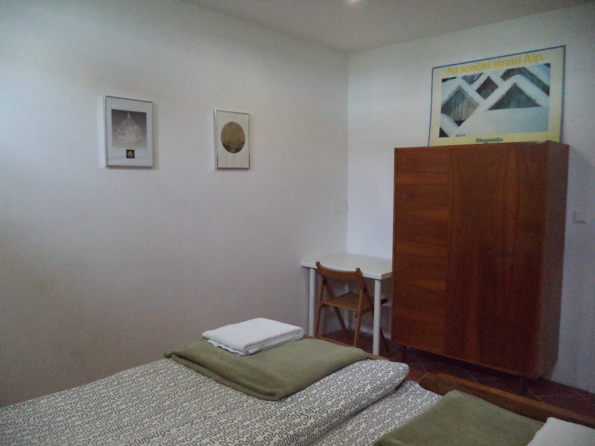 Another view of the main bedroom with beautiful paintings on the wall