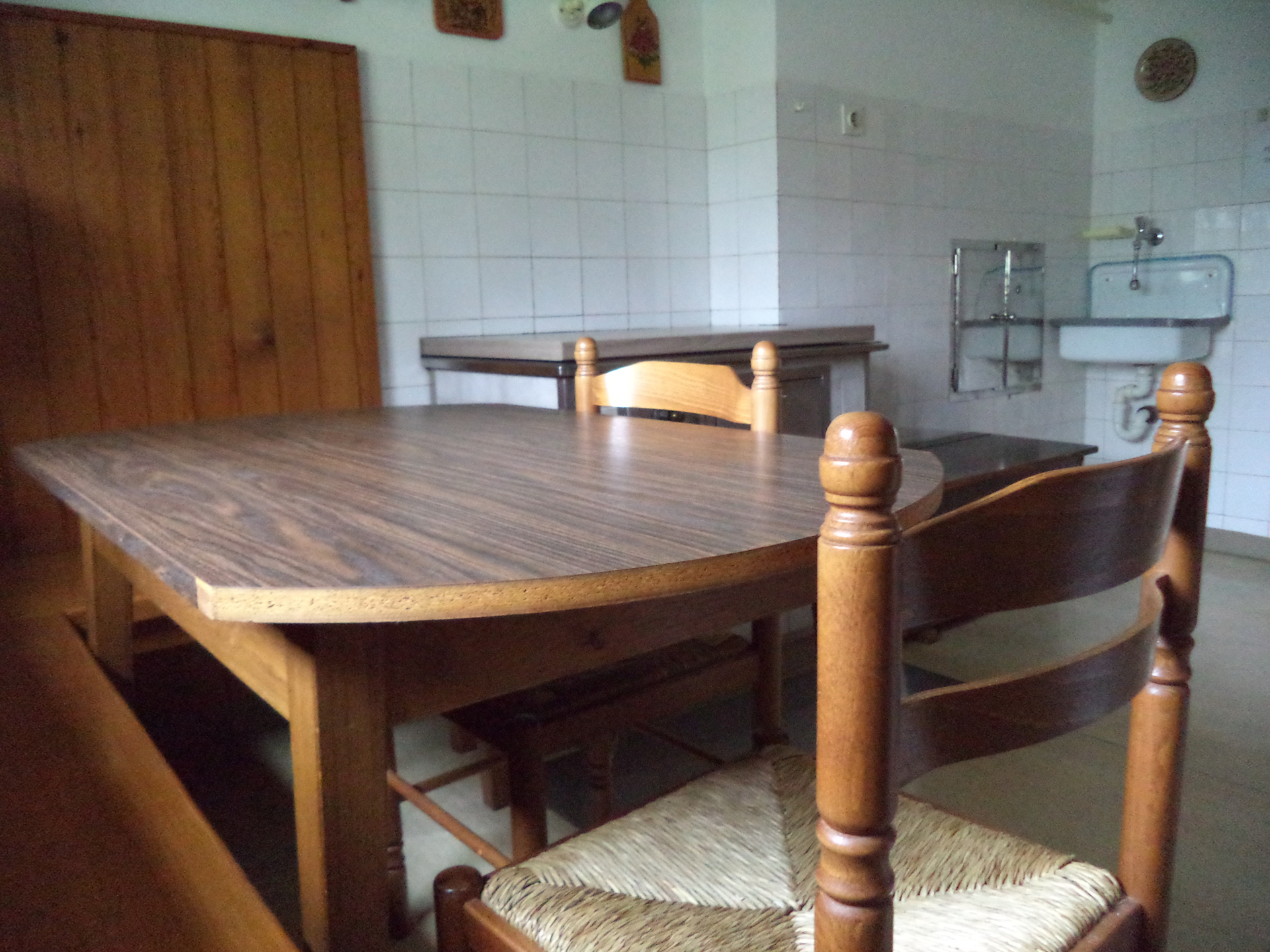 The cozy dining room with a table (rustic apartment).