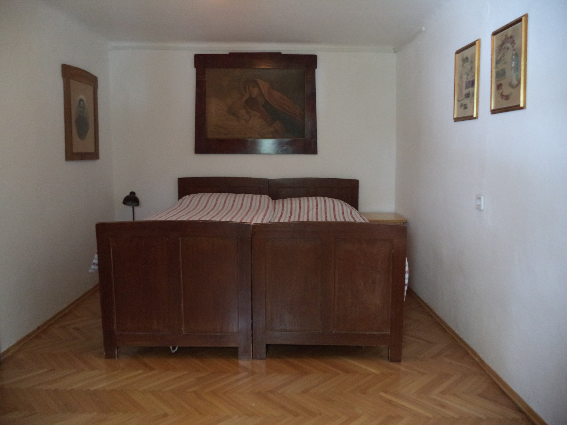 The cozy master bedroom in the rustic apartment.